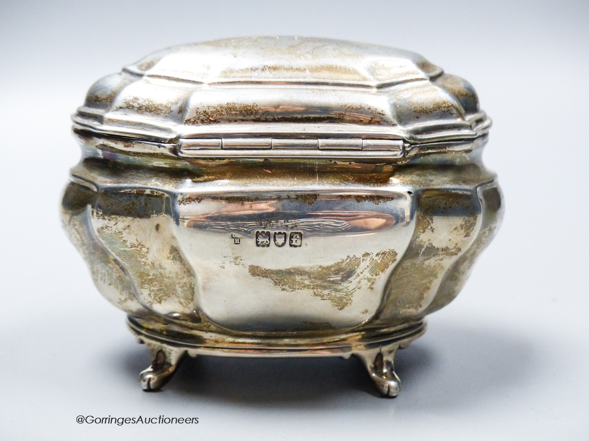 An Edwardian silver shaped oval tea caddy, Charles Stuart Harris Ltd, London, 1902, length 13.4cm, 7.5oz.